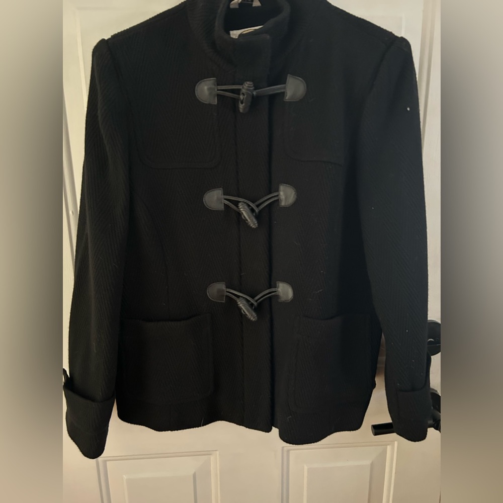 Beautiful black jacket with toggle closure and zipper.